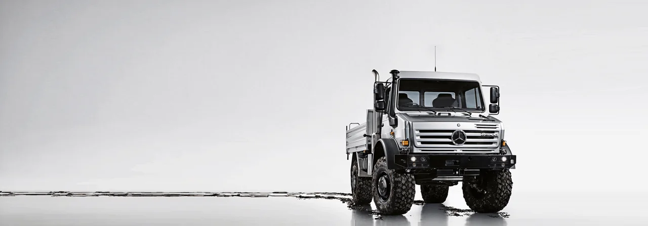 Mercedes-Benz Unimog specialised off-road truck on a neutral studio background